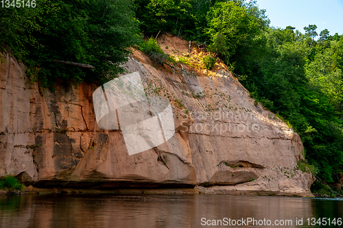 Image of Red sandstone cliff on coast of the river 