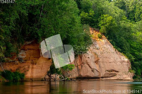 Image of Red sandstone cliff on coast of the river 
