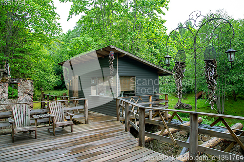 Image of Wooden hut near to the trees