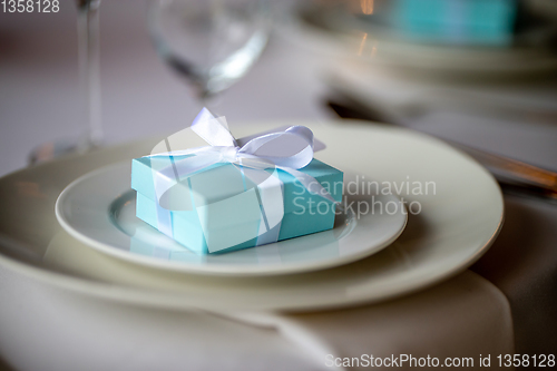 Image of Light blue gift box on the plate