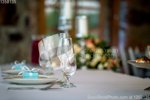 Image of Glasses and gift boxes on the table