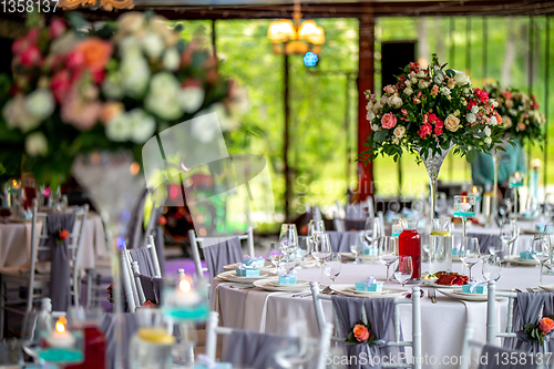 Image of Wedding table decorated with flowers and dishes