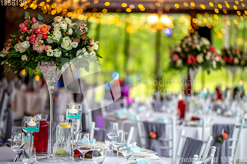 Image of Wedding table decorated with flowers and dishes