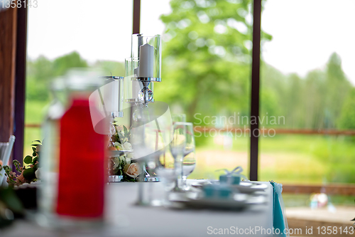 Image of Candles and dishes on the festive table