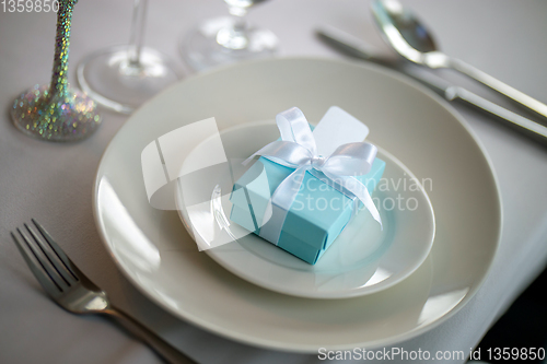 Image of Light blue gift box on the plate