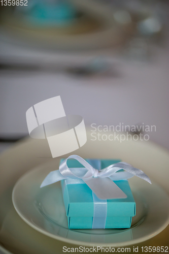 Image of Light blue gift box on the plate