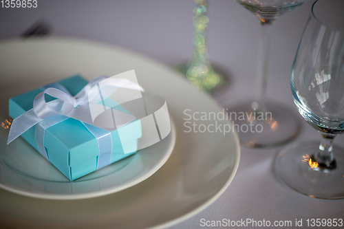 Image of Light blue gift box on the plate