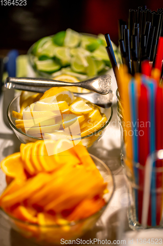 Image of Orange, lemon and lime slices on the wedding table