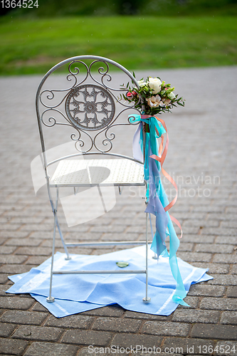 Image of Chair with  flowers and towels
