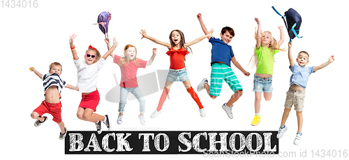 Image of Group of elementary school kids jumping, back to school