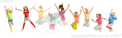 Image of Group of elementary school kids jumping, back to school