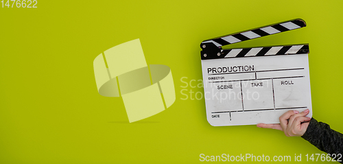 Image of movie clapper on green  background