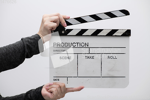 Image of movie clapper on white background