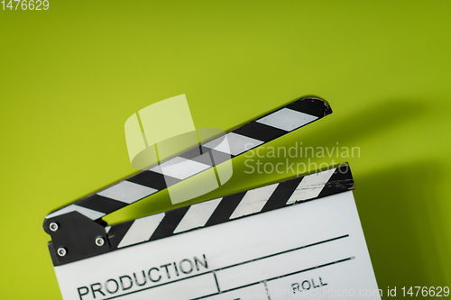 Image of movie clapper on green  background