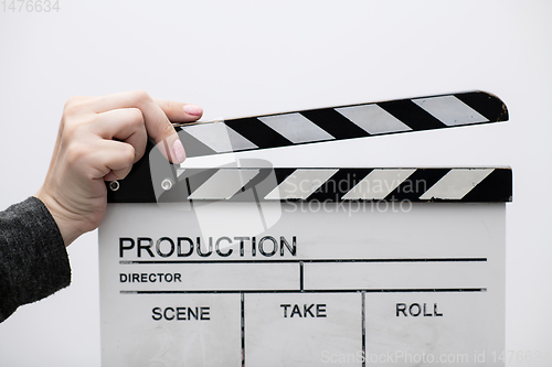 Image of movie clapper on white background