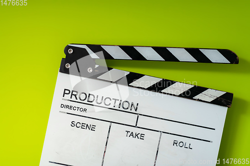 Image of movie clapper on green  background