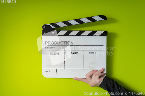 Image of movie clapper on green  background