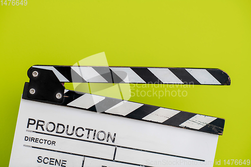 Image of movie clapper on green  background