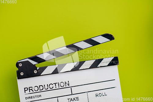 Image of movie clapper on green  background