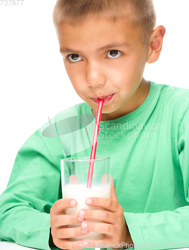 Image of Cute little boy with a glass of milk