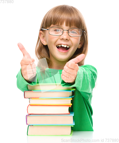 Image of Little girl is reading a book