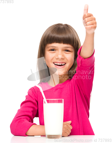 Image of Cute little girl with a glass of milk