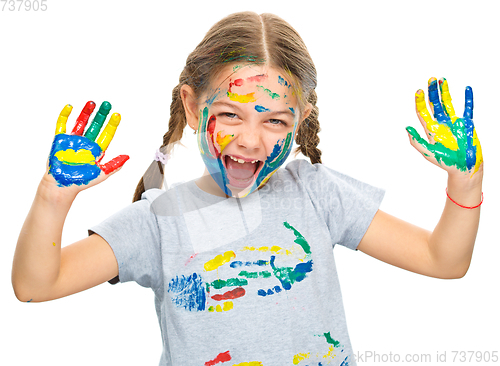 Image of Portrait of a cute girl playing with paints