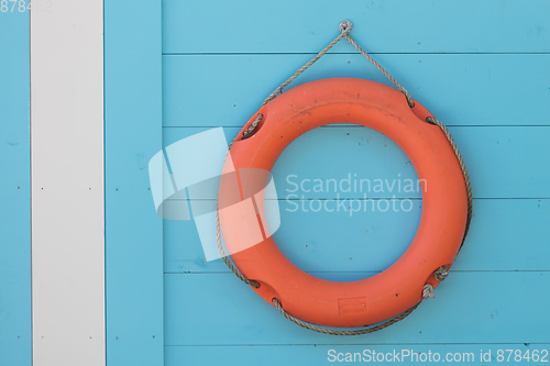 Image of Red life buoy hanging 