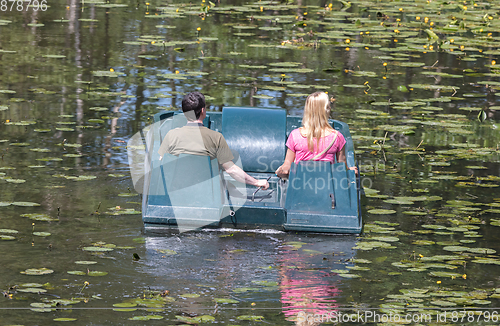 Image of Unrecognisable people in a watercycle