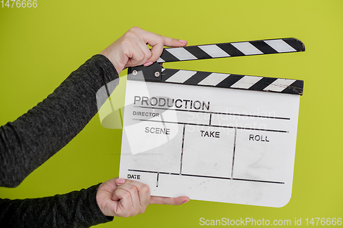 Image of movie clapper on green  background