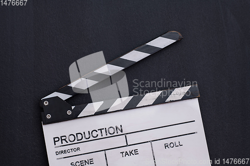 Image of movie clapper on balck chalkboard background