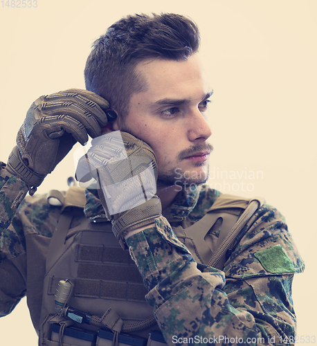 Image of soldier preparing gear for action