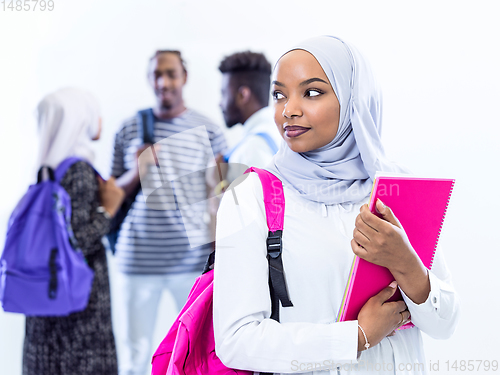 Image of portrait of african female student with group of friends