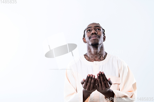 Image of african man pray to Allah