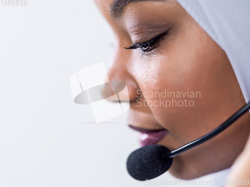 Image of african customer representative business woman with phone headse