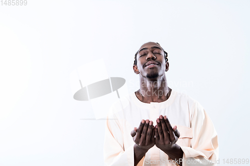 Image of african man pray to Allah