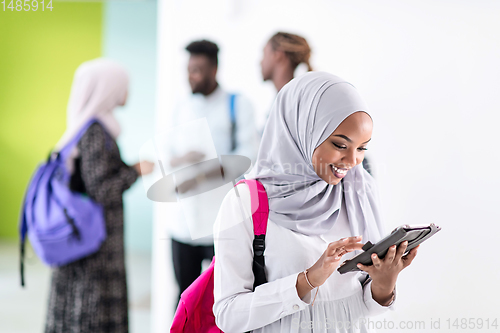 Image of african female student with group of friends