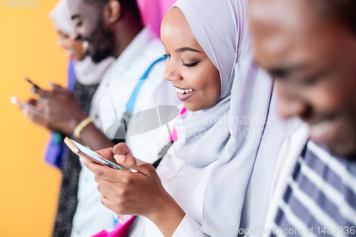 Image of african students group using smart phones