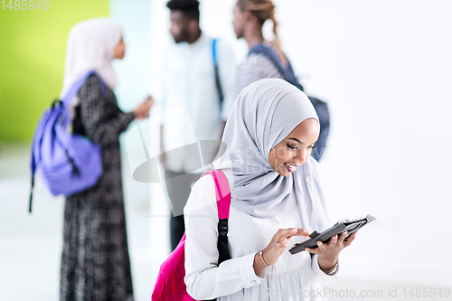 Image of african female student with group of friends