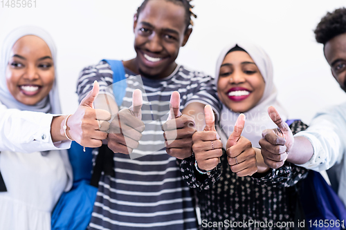 Image of african students group showing ok thumbs up