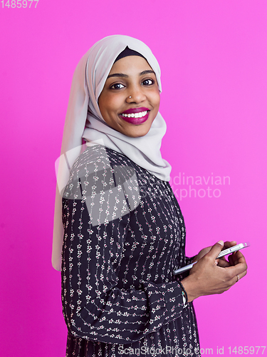Image of modern muslim business woman using smartphone