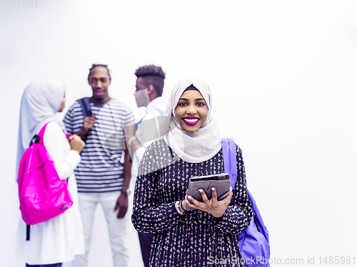 Image of muslim female student with group of friends