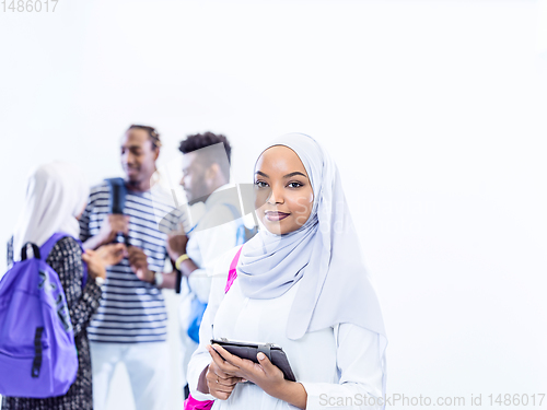 Image of muslim female student with group of friends