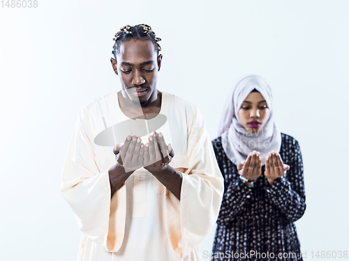 Image of african muslim couple praying