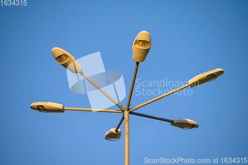 Image of Six LED street Lamps at tall metal post