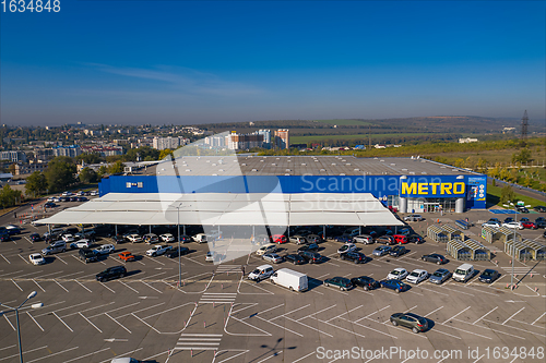 Image of Metro retail store, large shopping mall of household and food goods with parking, aerial view, copyspace