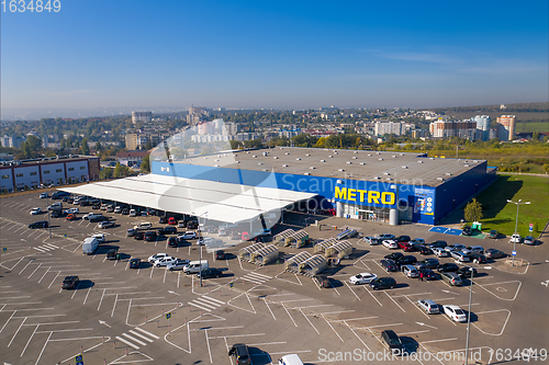 Image of Metro retail store, large shopping mall of household and food goods with parking, aerial view, copyspace