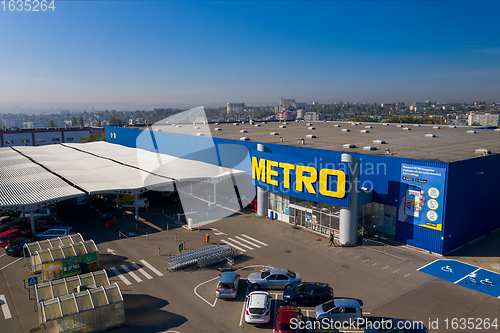Image of Metro retail store, large shopping mall of household and food goods with parking, aerial view, copyspace