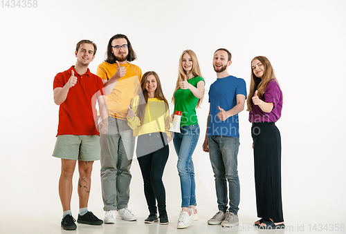 Image of Young people weared in LGBT flag colors isolated on white background, LGBT pride concept