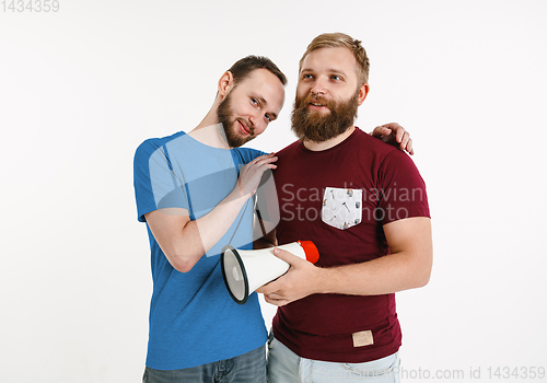 Image of Young men weared in LGBT flag colors isolated on white background, LGBT pride concept